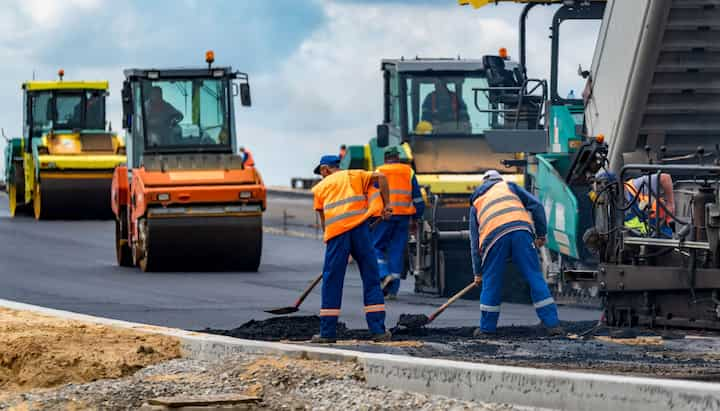 Professional asphalt contractors laying asphalt down in Mesa, Arizona.